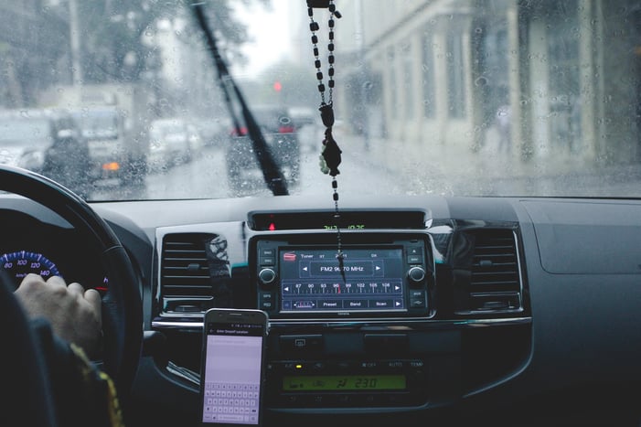 photo-of-person-driving-car-while-raining-1024241